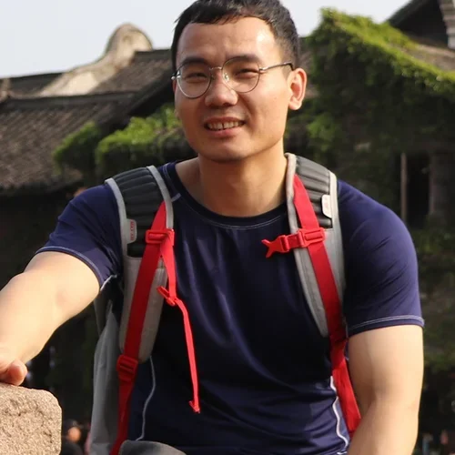 Headshot: a person smiling outdoors